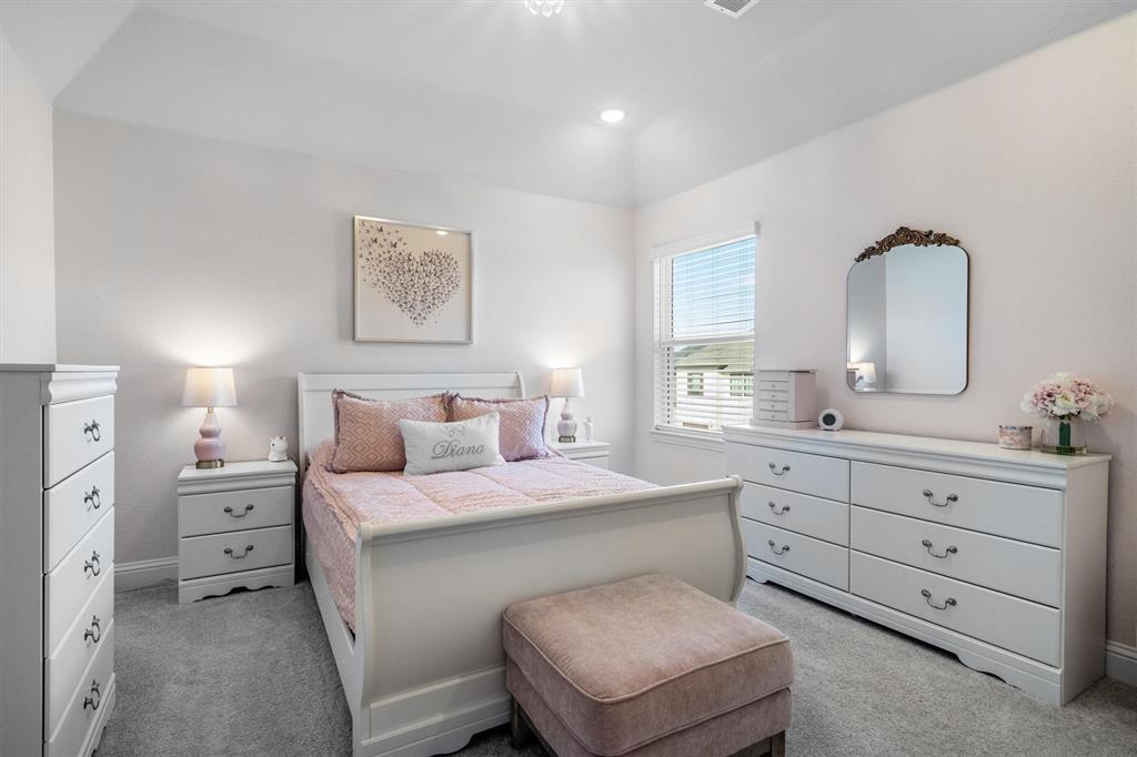 1308 Redbrick Lane Northlake, TX 76247 - Photo 31 of 40 a bedroom with a bed and a dresser