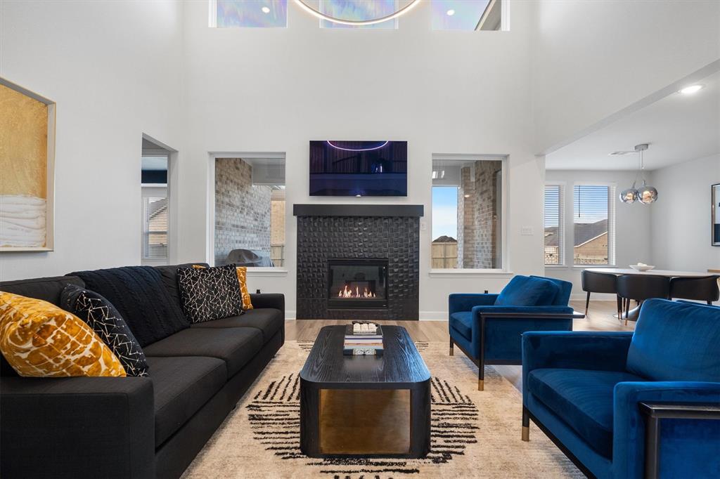 1308 Redbrick Lane Northlake, TX 76247 - Photo 10 of 40 a living room with furniture and a fireplace