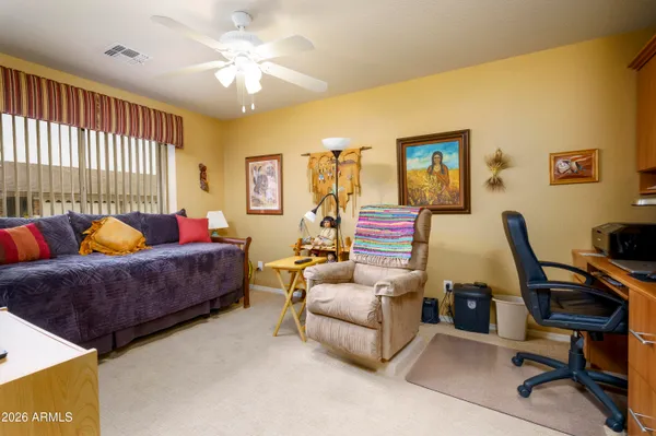 a living room with furniture and a window