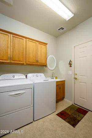 a kitchen with a stove cabinets and window