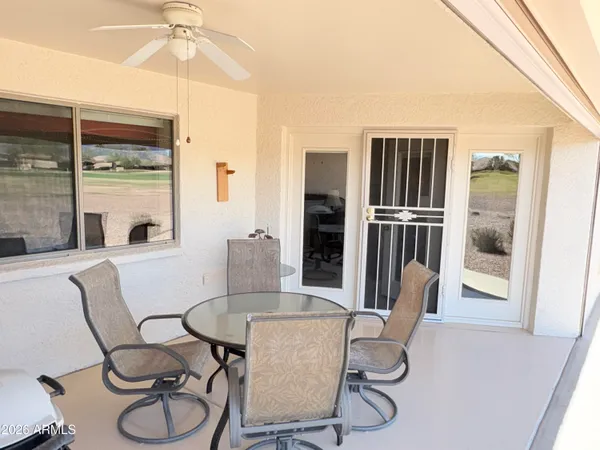 a dining room with furniture and window