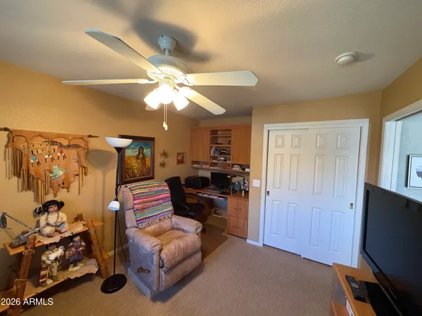 a bedroom with furniture and a chandelier