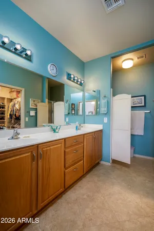 a kitchen with sink and refrigerator