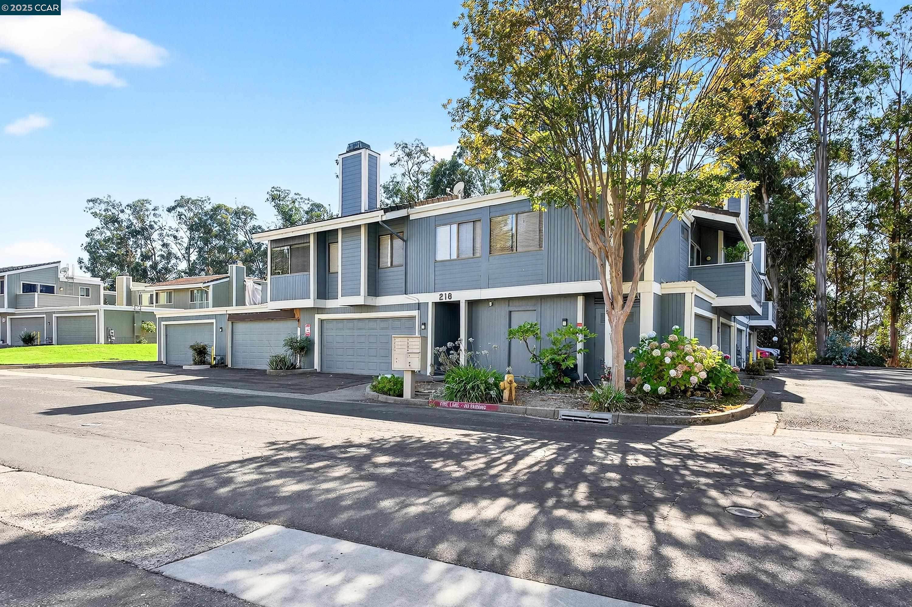 218 Apollo, Unit 4 Hercules, CA 94547 - Photo 1 of 1 a front view of a house with a garden