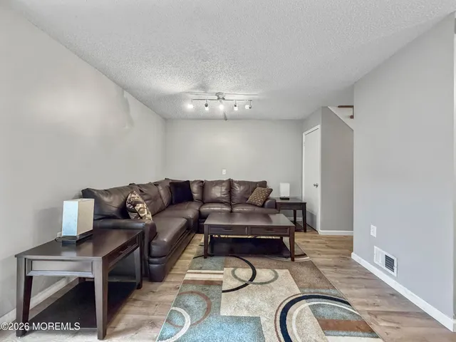 a bathroom with a sink mirror and toilet