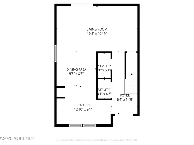 a view of a tennis ground with large trees