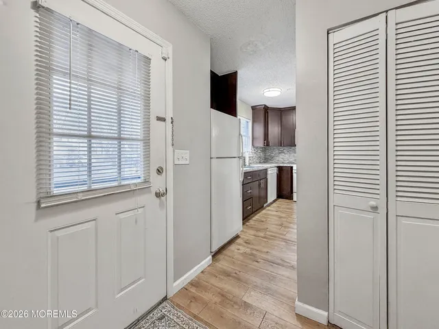 a view of a kitchen from the hallway