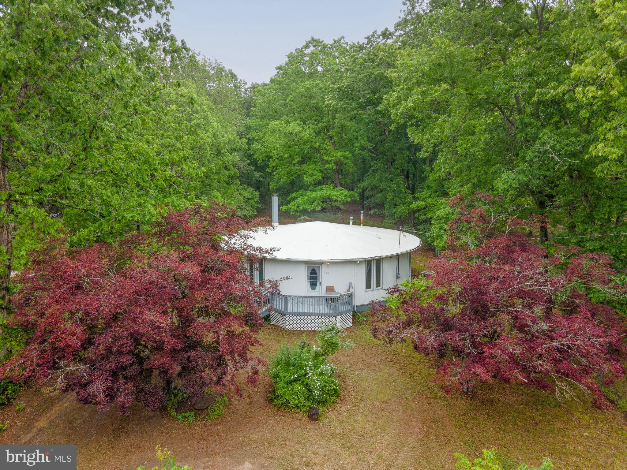 188 Carlisle Place Road Leesburg, NJ 08327 - Photo 34 of 36 a view of a swimming pool with a yard and plants