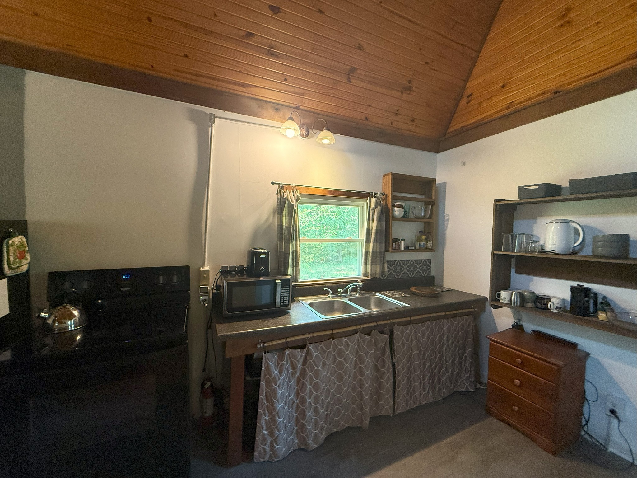 170 Webb Road Summertown, TN 38483 - Photo 3 of 39 a kitchen with stainless steel appliances granite countertop a sink and a stove