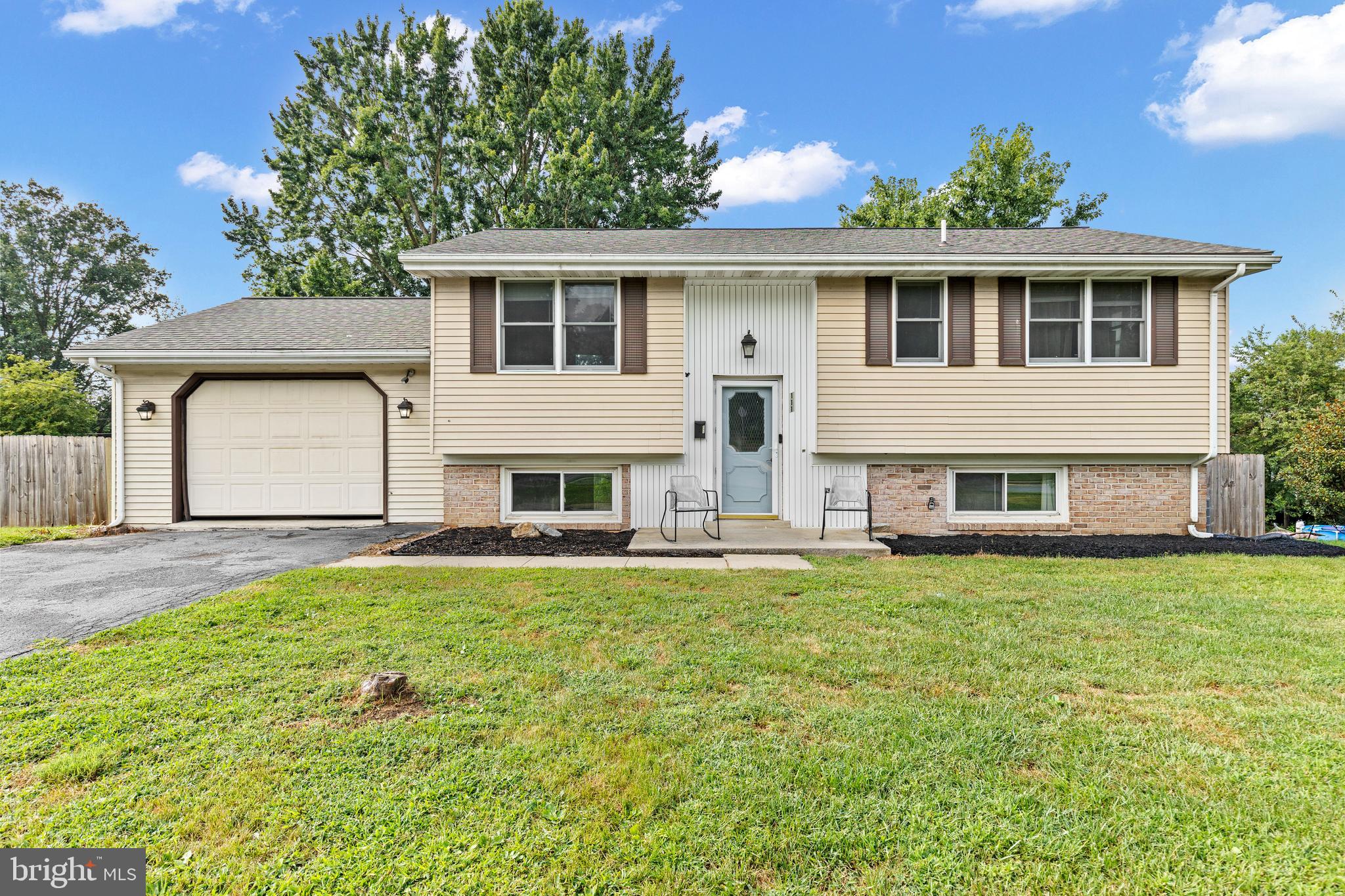 111 Oxford Drive Lititz, PA 17543 - Photo 1 of 33 a front view of a house with a garden