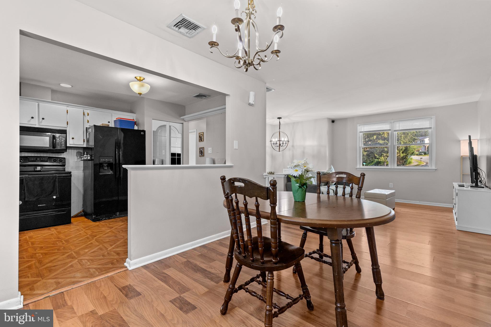 111 Oxford Drive Lititz, PA 17543 - Photo 11 of 33 a view of a dining room with furniture and wooden floor