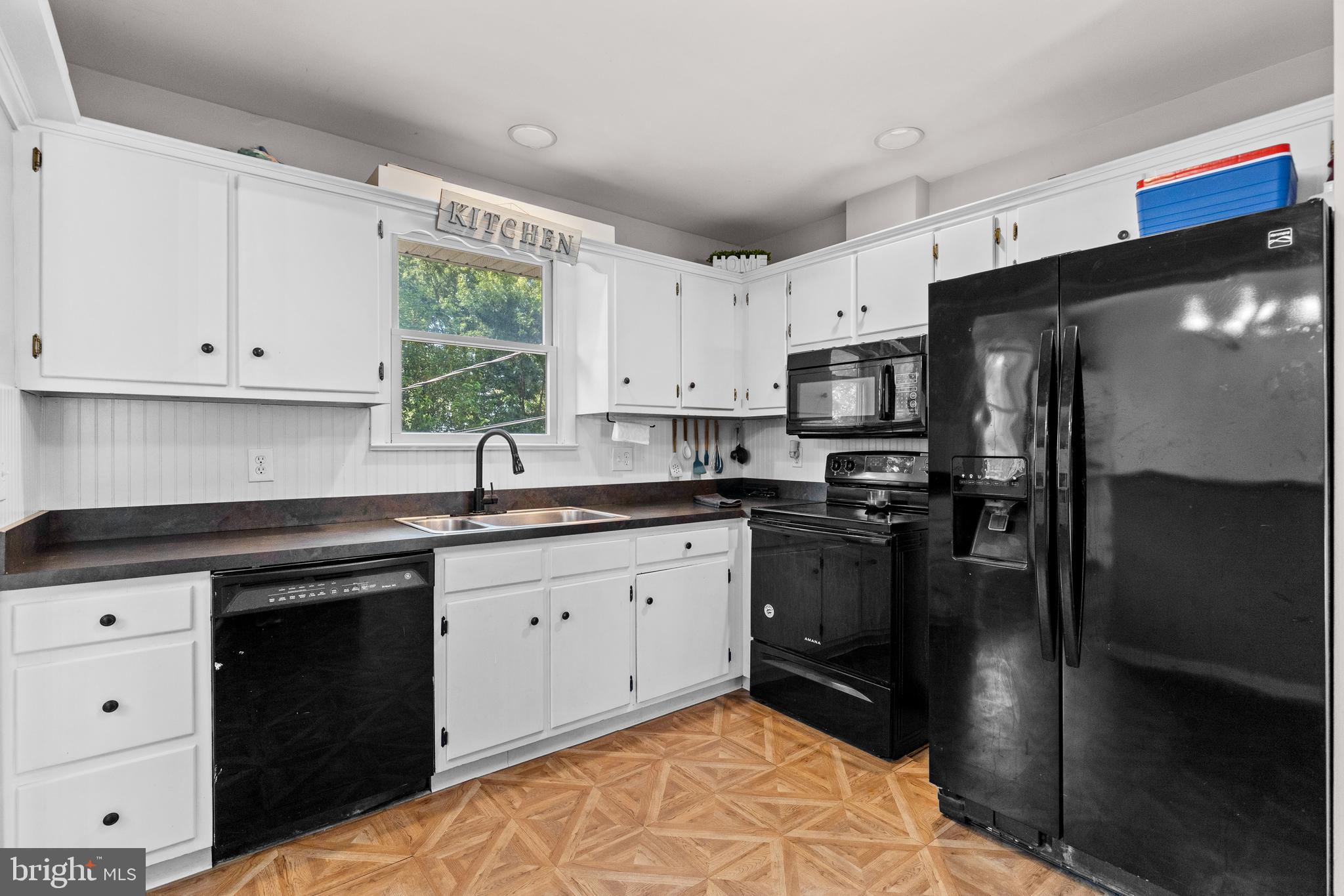 111 Oxford Drive Lititz, PA 17543 - Photo 12 of 33 a kitchen with a sink stove and refrigerator