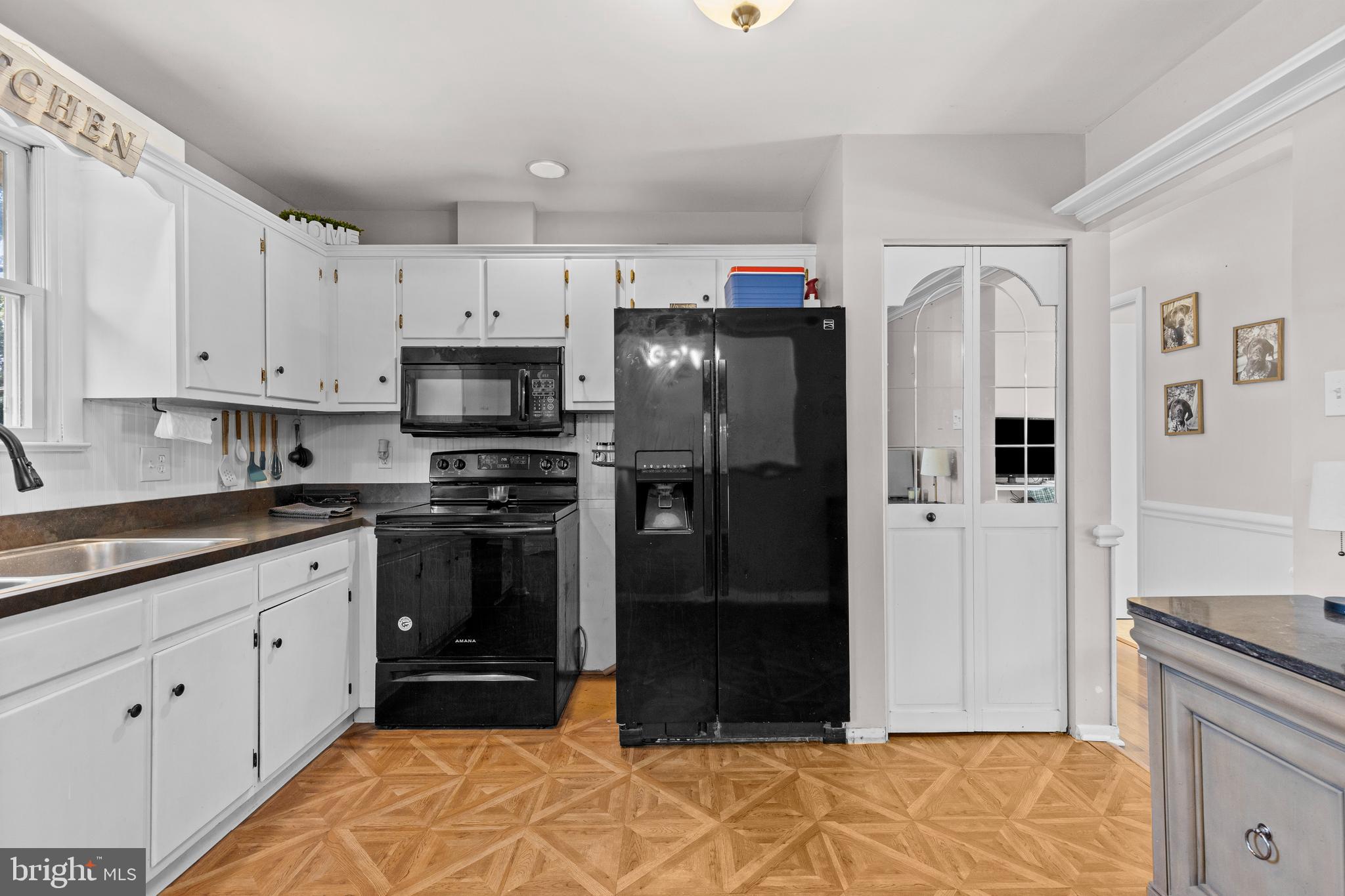 111 Oxford Drive Lititz, PA 17543 - Photo 13 of 33 a kitchen with stainless steel appliances granite countertop a refrigerator and a stove top oven