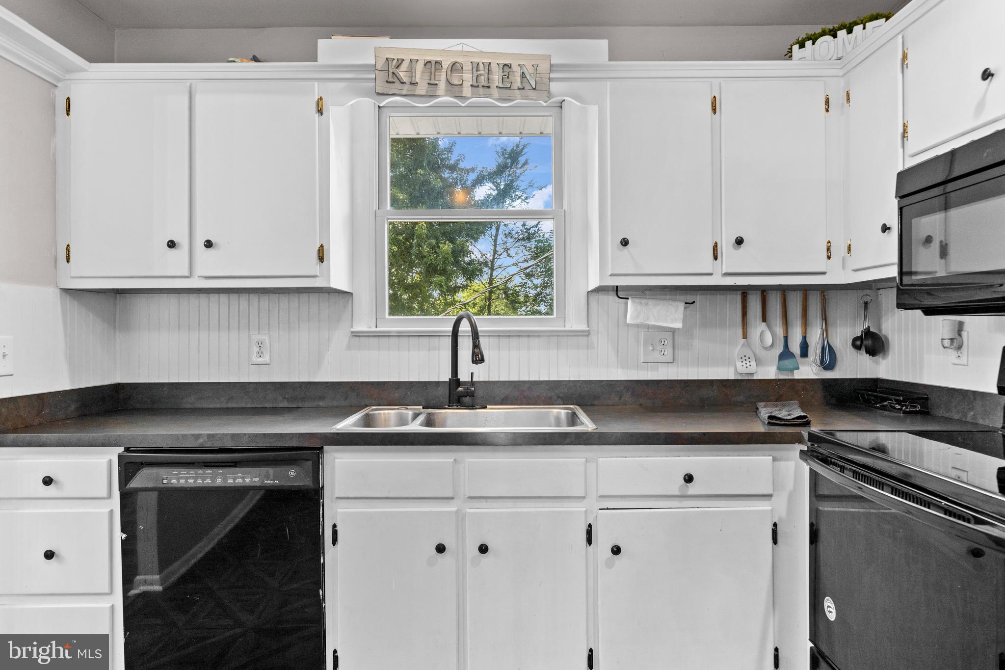 111 Oxford Drive Lititz, PA 17543 - Photo 14 of 33 a kitchen with granite countertop white cabinets and a stove