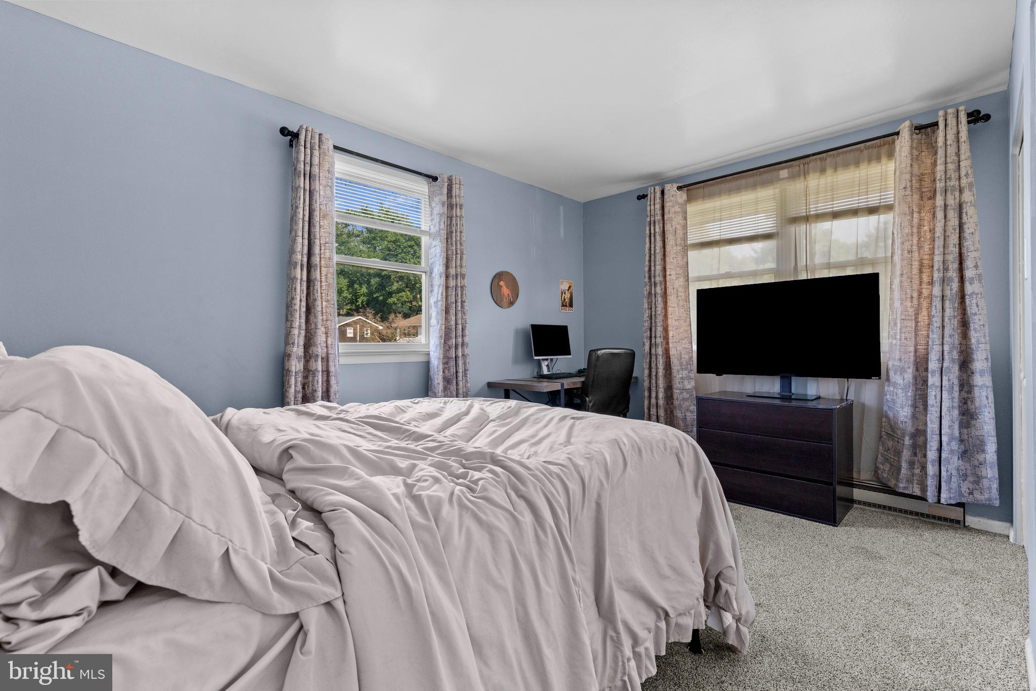 111 Oxford Drive Lititz, PA 17543 - Photo 18 of 33 a bedroom with a bed and a flat screen tv