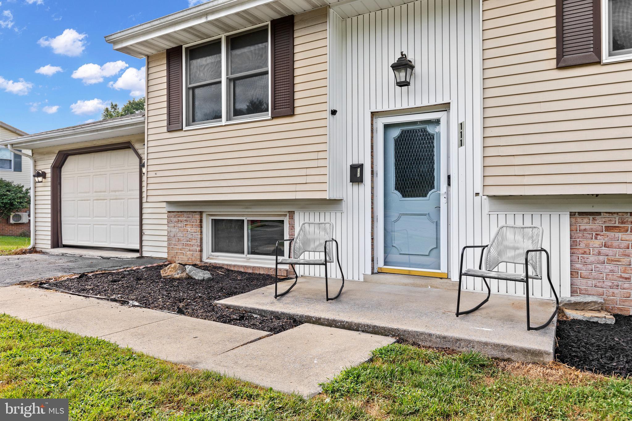 111 Oxford Drive Lititz, PA 17543 - Photo 5 of 33 a front view of a house with garden
