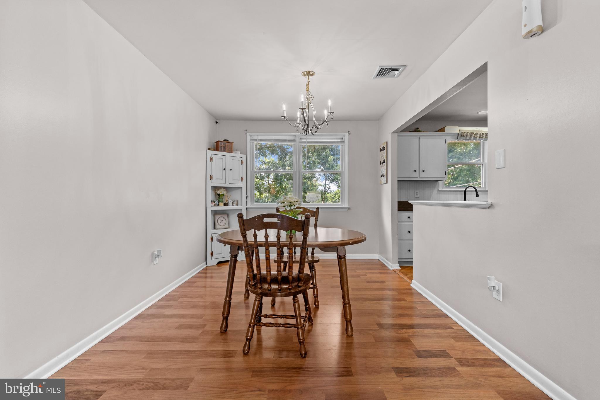 111 Oxford Drive Lititz, PA 17543 - Photo 10 of 33 a view of a dining room with furniture window and wooden floor