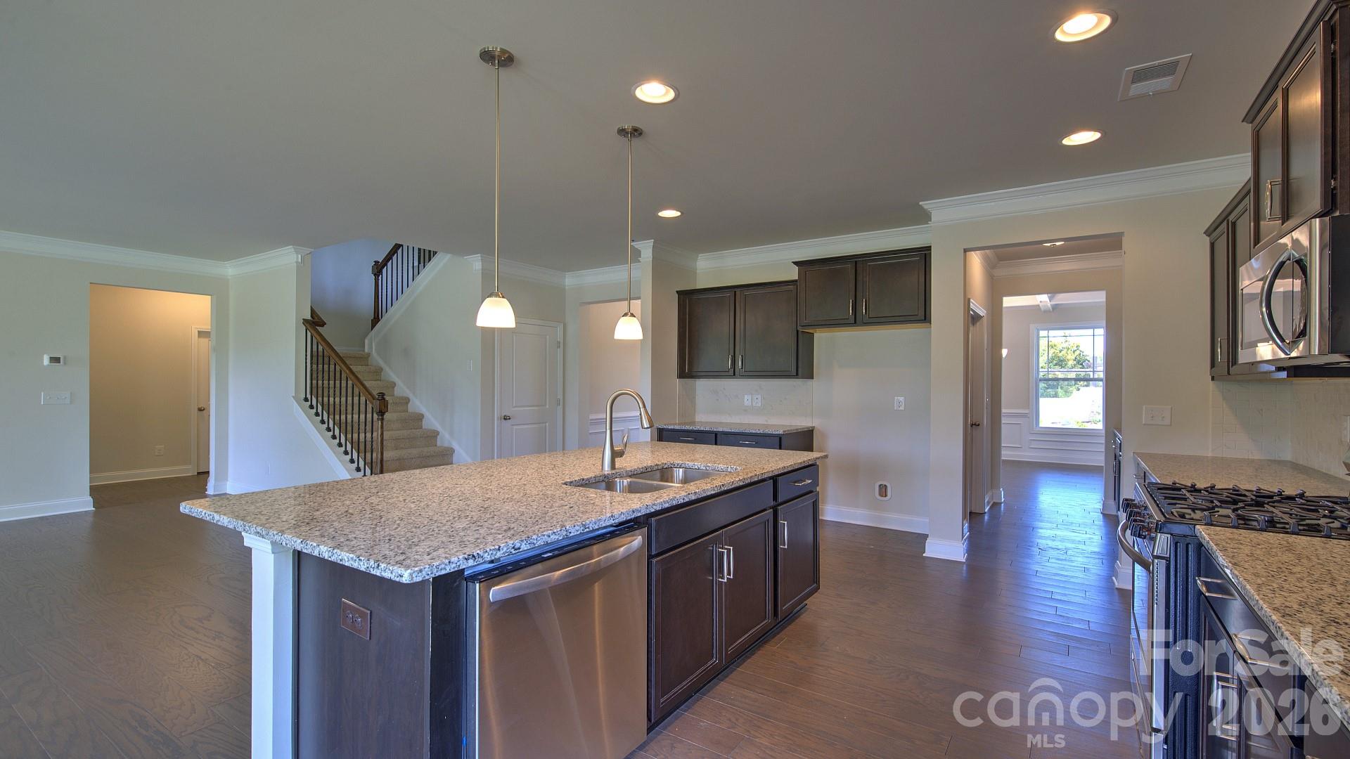 505 River Btm Road Fletcher, NC 28732 - Photo 8 of 20 a kitchen with center island table and chairs