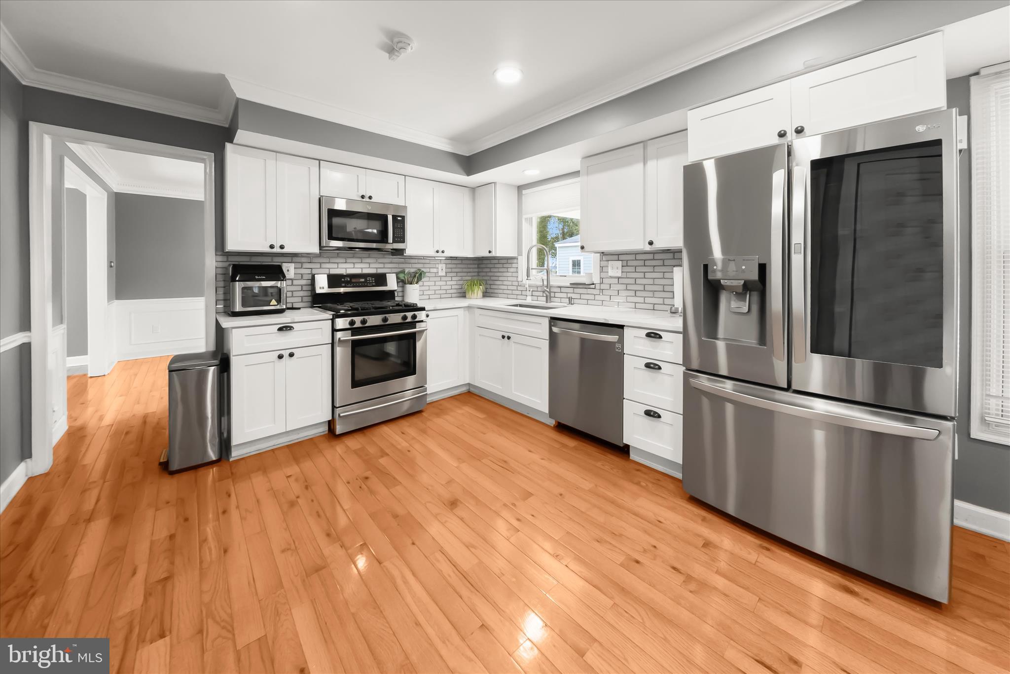 10712 Gainsborough Road Potomac, MD 20854 - Photo 12 of 53 a kitchen with granite countertop stainless steel appliances a refrigerator sink and microwave