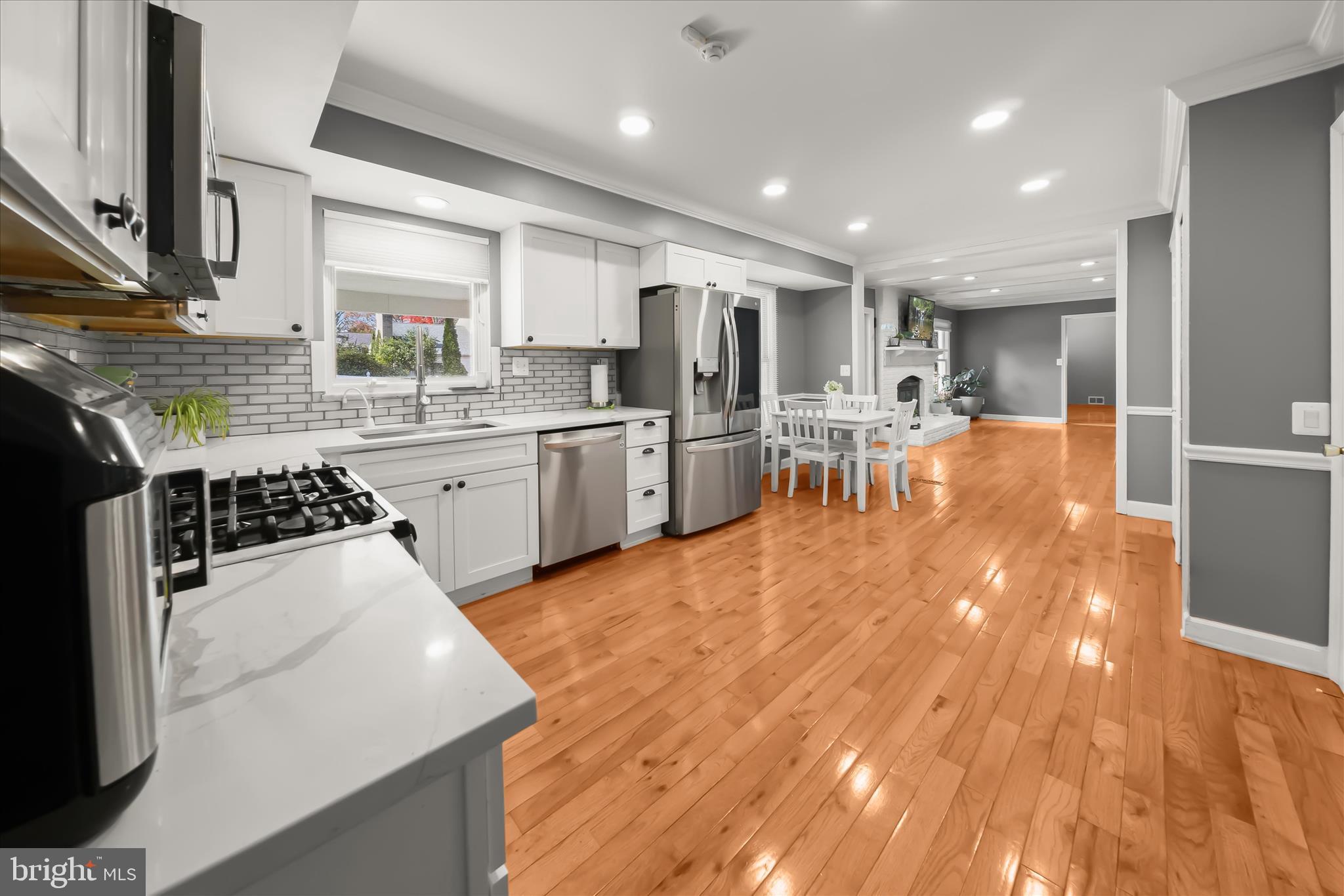 10712 Gainsborough Road Potomac, MD 20854 - Photo 14 of 53 a kitchen with stainless steel appliances granite countertop a sink stove and refrigerator