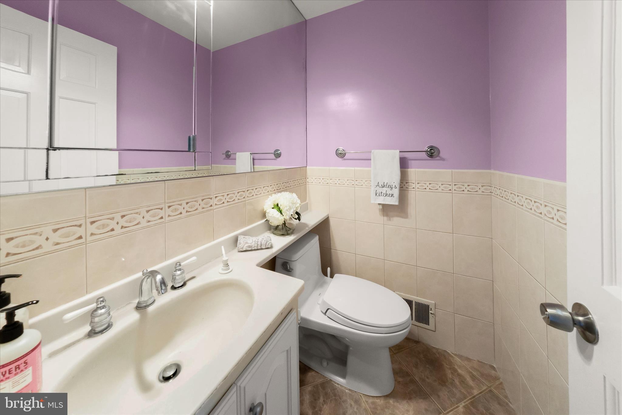 10712 Gainsborough Road Potomac, MD 20854 - Photo 16 of 53 a bathroom with a sink mirror vanity and toilet