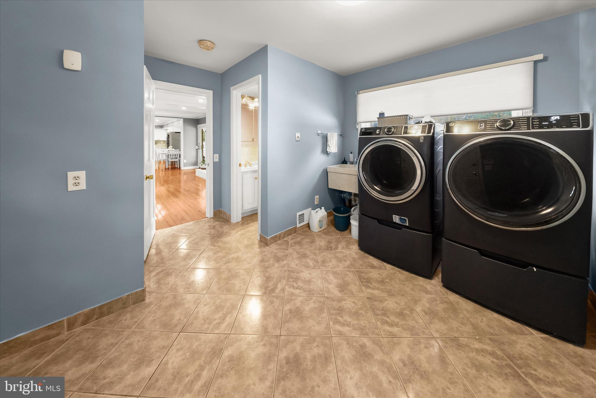 10712 Gainsborough Road Potomac, MD 20854 - Photo 18 of 53 a view of a hallway with washer and dryer