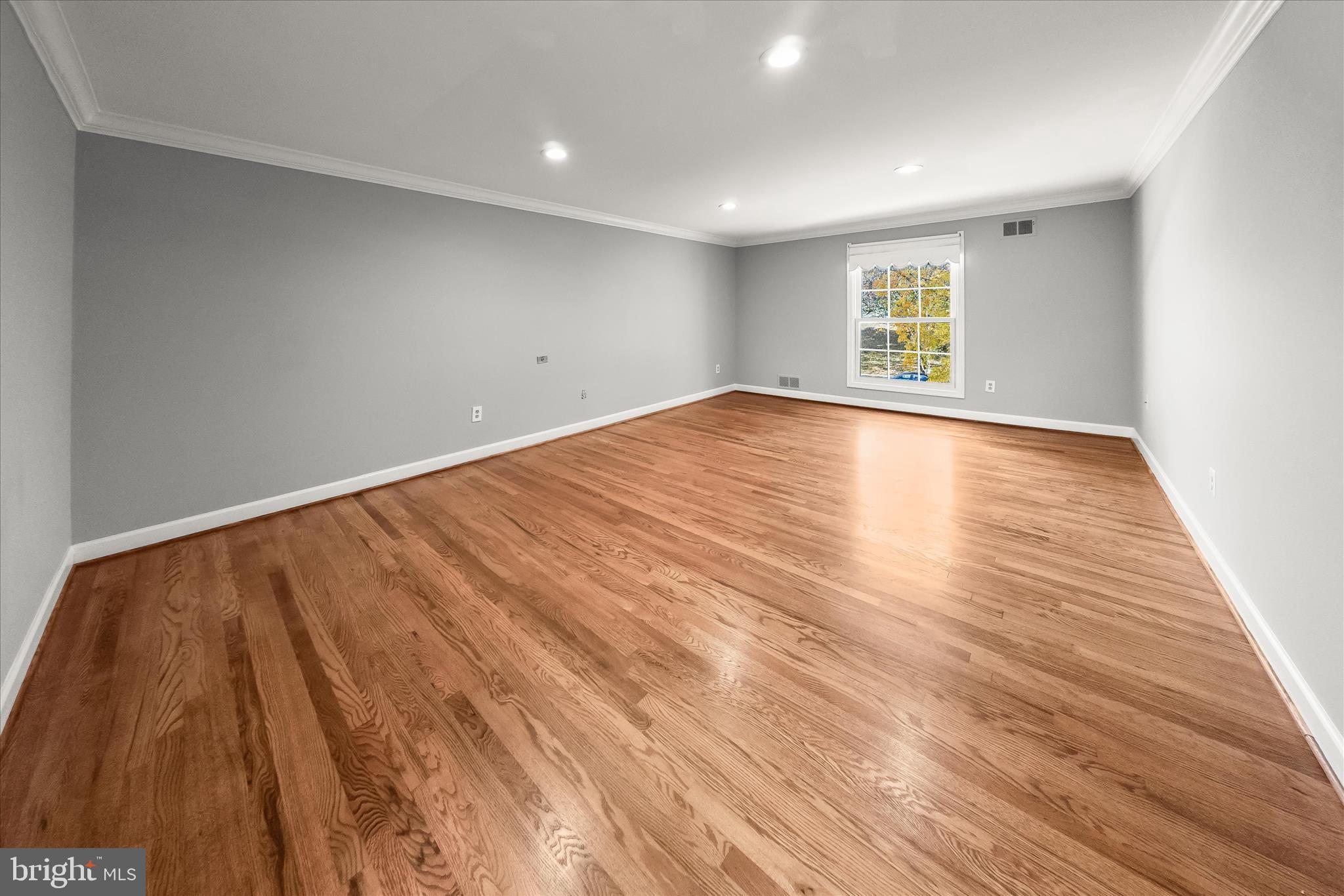 10712 Gainsborough Road Potomac, MD 20854 - Photo 26 of 53 wooden floor in an empty room with a window