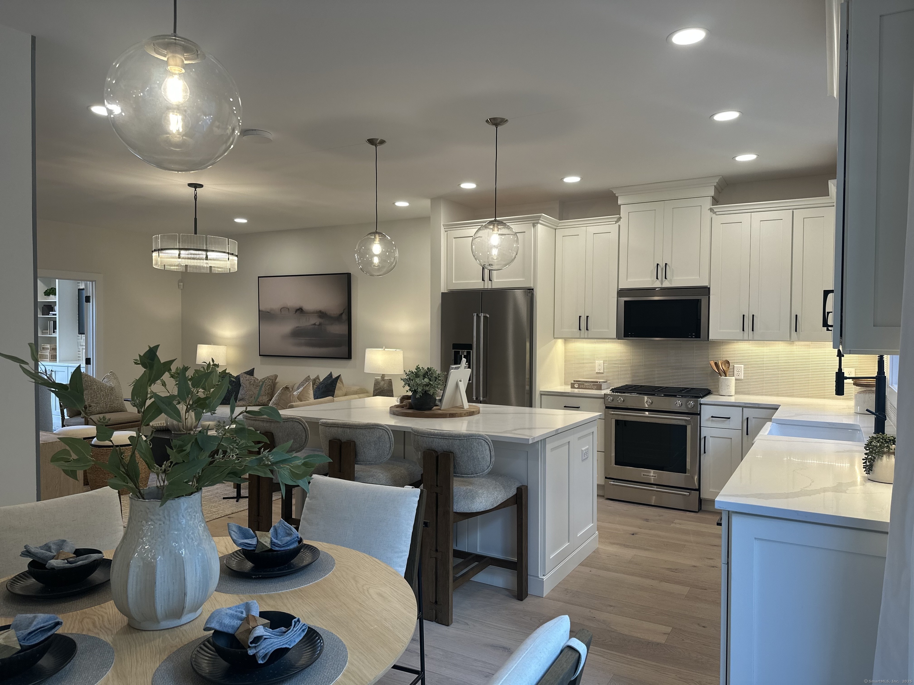 a kitchen with a stove a sink and a refrigerator