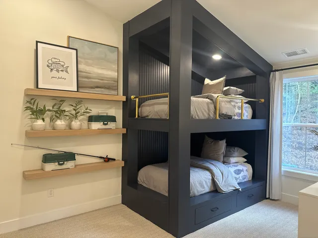 a bedroom with a bed and lamp