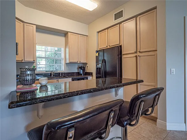 a view of a kitchen with a large window