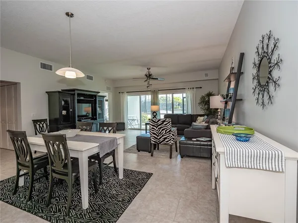 a dining room with furniture and window