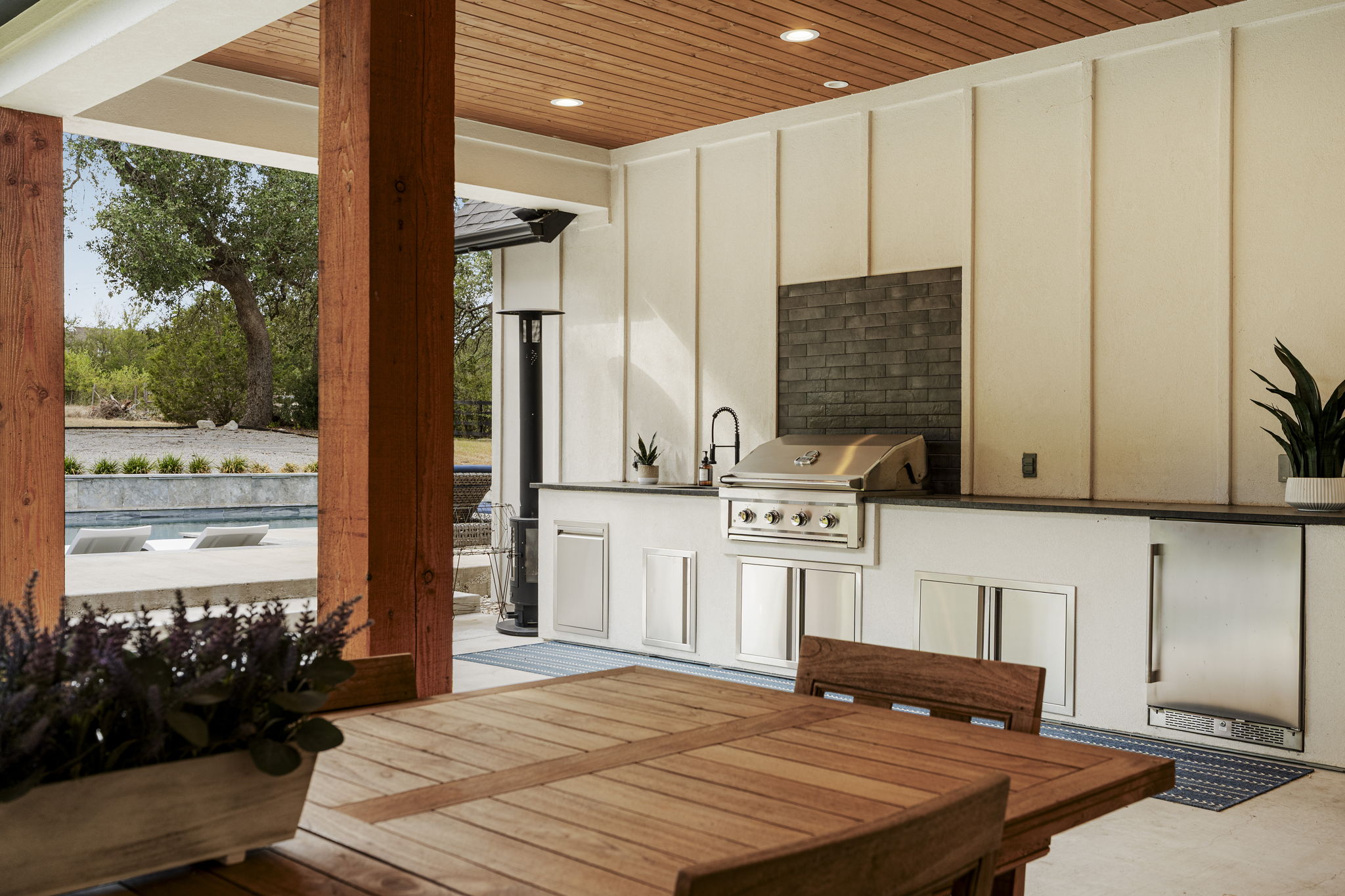32831 Ranch Road 12 Dripping Springs, TX 78620 - Photo 35 of 40 Outdoor kitchen conveniently located off the kitchen and right by the pool