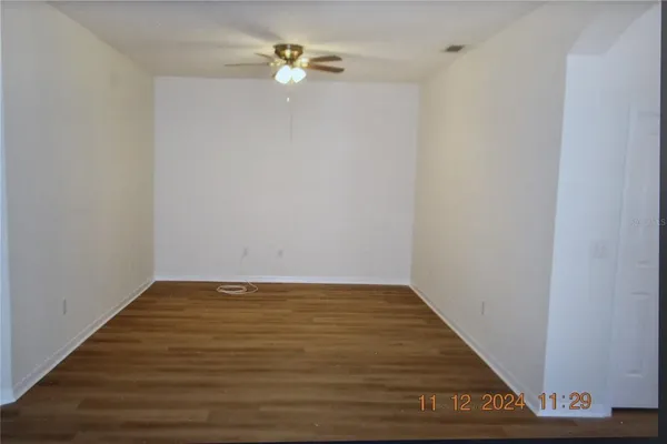 a view of an empty room with closet