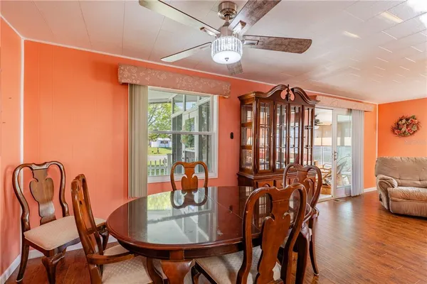 a view of a dining room with furniture window and wooden floor