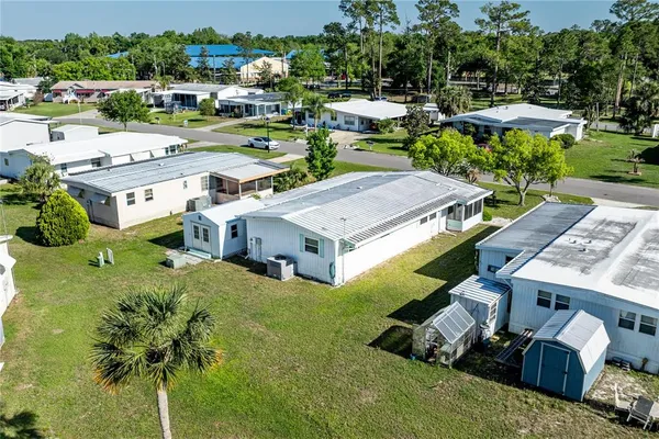 a aerial view of a house with garden space and street view
