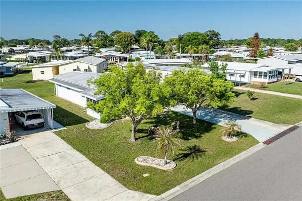 a view of a swimming pool with a patio and yard