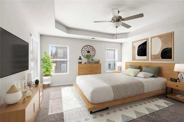 a view of an empty room with a ceiling fan