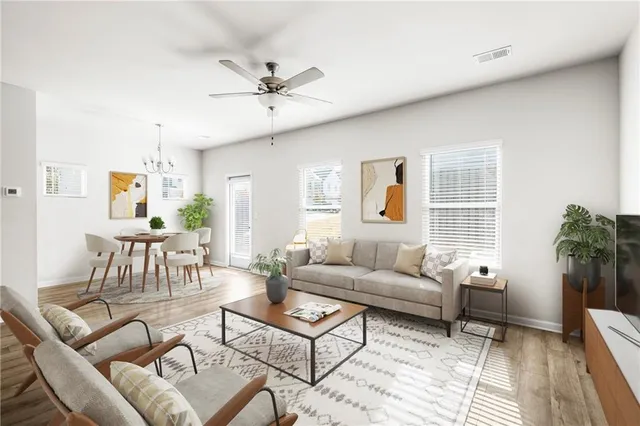 a living room with furniture and a large window