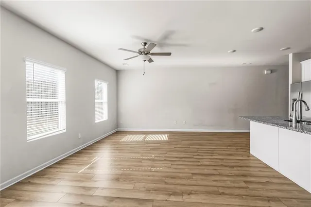 a kitchen with granite countertop a sink and a window