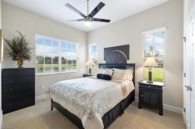 a bathroom with a toilet a sink and a mirror