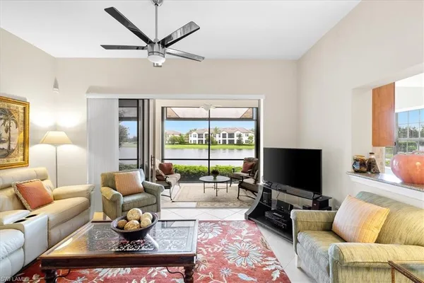 a front view of a house with a garden and yard