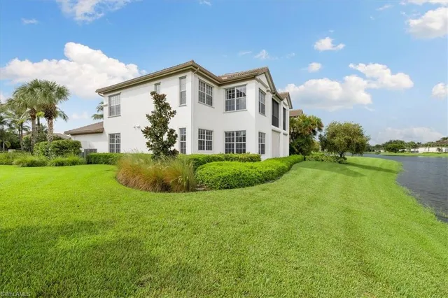 a living room with furniture a large window and a flat screen tv