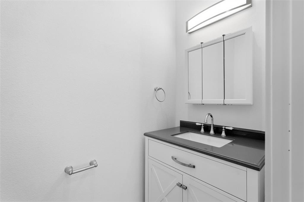 1110 Norris Street Commerce, TX 75428 - Photo 30 of 40 a close view of a sink and a vanity in the bathroom