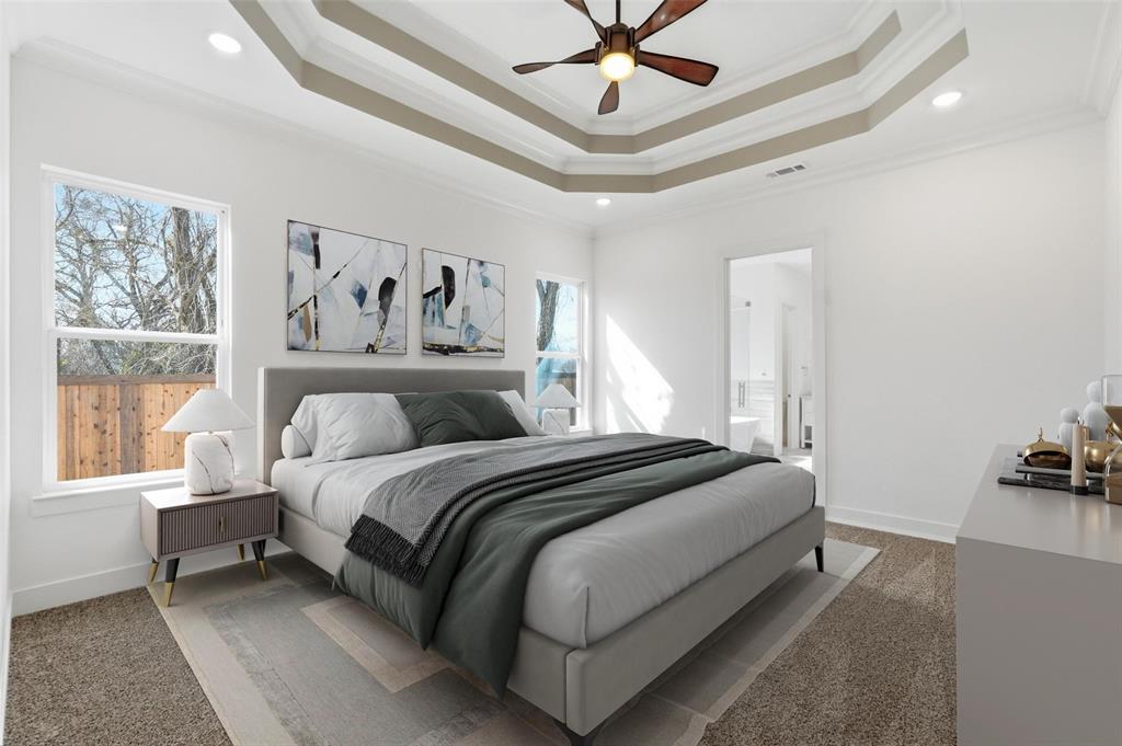 1110 Norris Street Commerce, TX 75428 - Photo 33 of 40 a spacious bedroom with a bed and ceiling fan