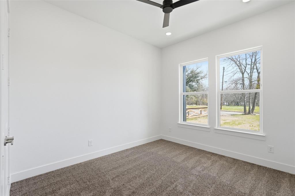 1110 Norris Street Commerce, TX 75428 - Photo 7 of 40 an empty room with windows