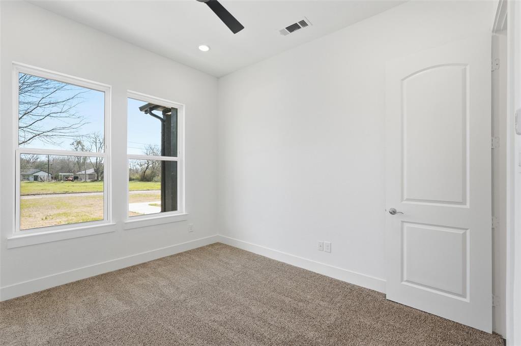 1110 Norris Street Commerce, TX 75428 - Photo 10 of 40 an empty room with a window