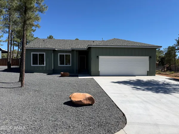 a front view of a house with yard