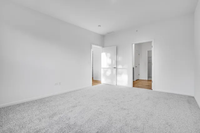 a view of empty room with a fireplace