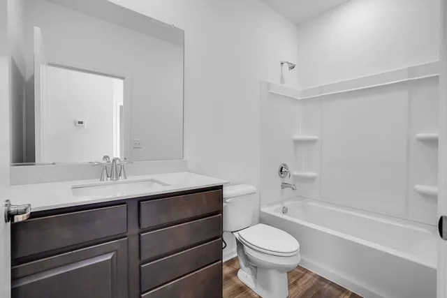 a bathroom with a sink a toilet and a bathtub