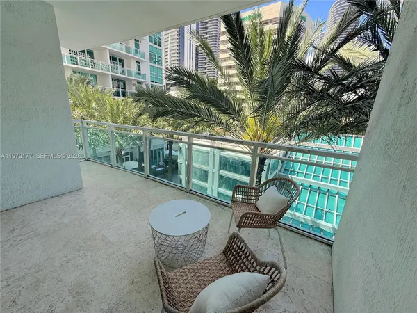 a view of balcony with furniture